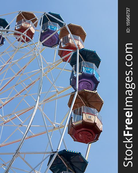 Colorfull big wheel over clear blue sky. Colorfull big wheel over clear blue sky.