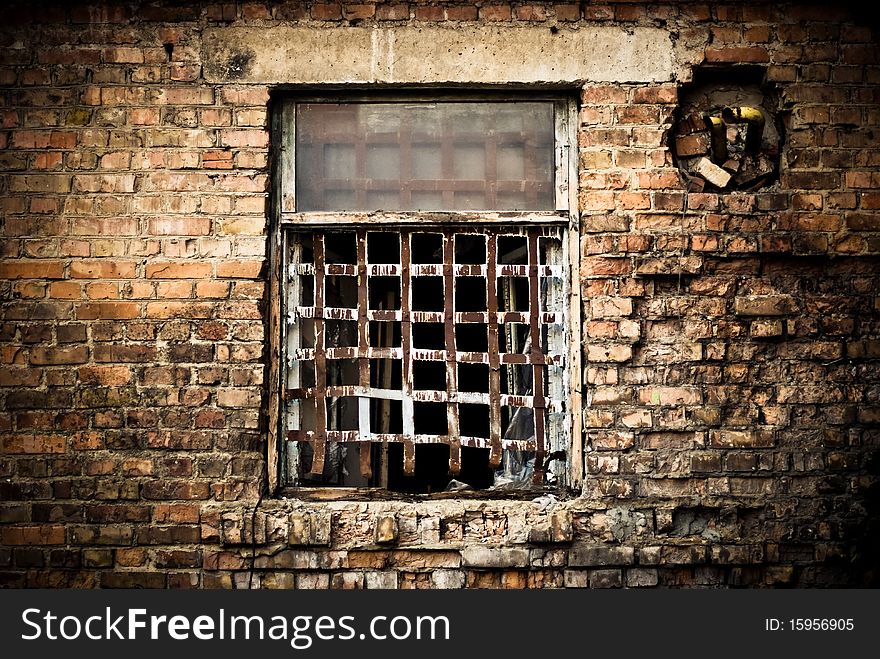 Old building window with rusty grate. Old building window with rusty grate