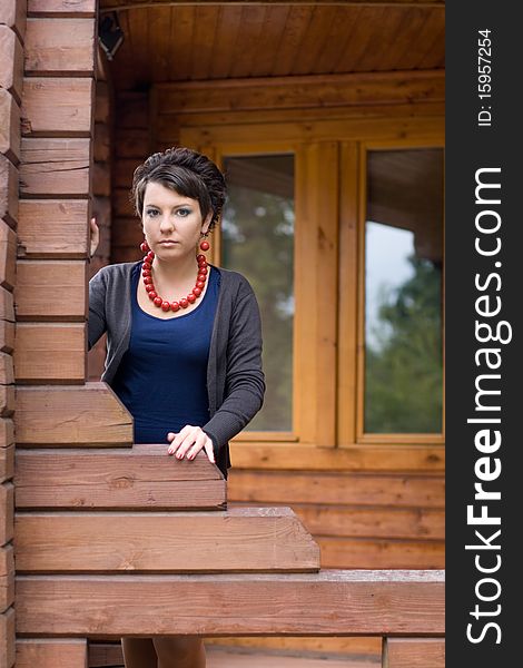 Girl standing on a veranda. Girl standing on a veranda