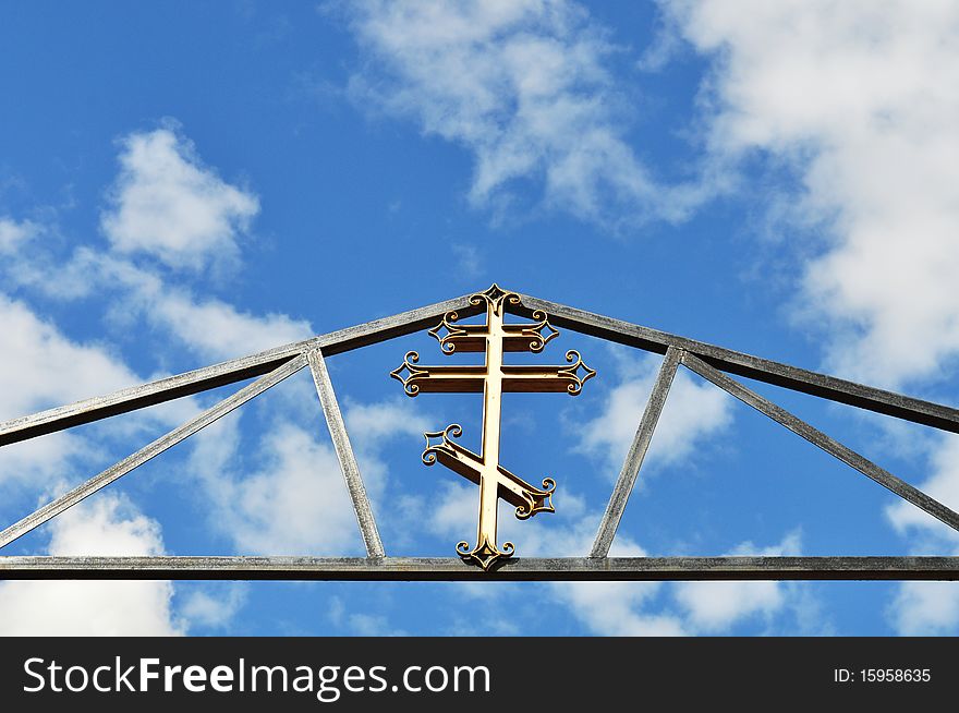 Christianity, creed and religion against the background of sky and clouds, gilded and shiny. Christianity, creed and religion against the background of sky and clouds, gilded and shiny