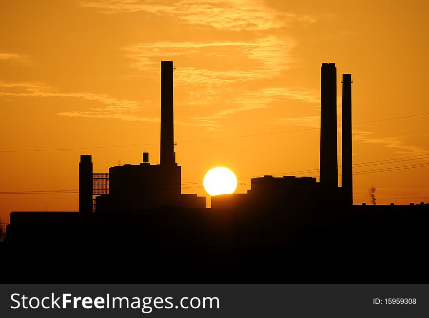 A power station at sunset. A power station at sunset.