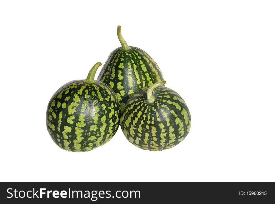 Three green small watermelons on white