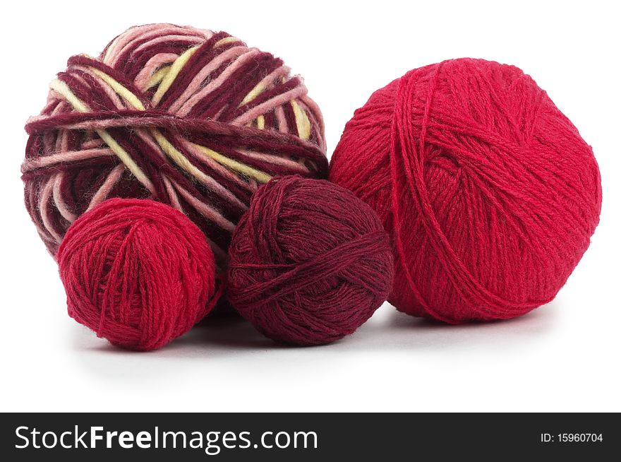Four colored wool clews