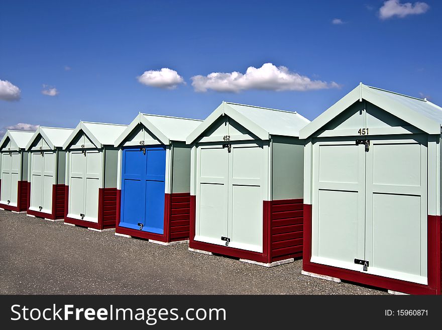 A row of blue beach huts on Hove sea-front