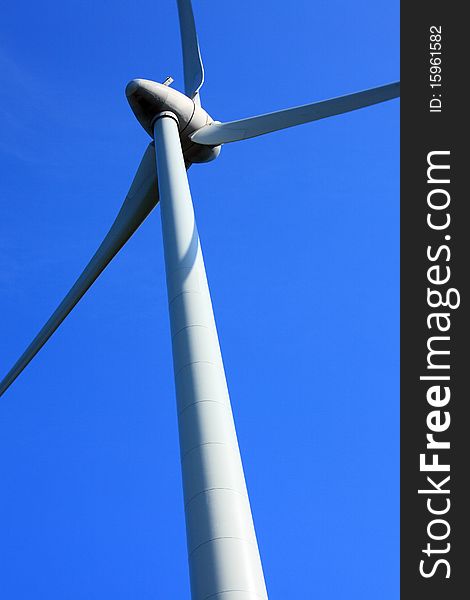 Wind turbine with blue sky in the background