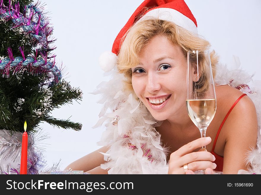 Beautiful woman wearing santa claus clothes with wine glass. Beautiful woman wearing santa claus clothes with wine glass
