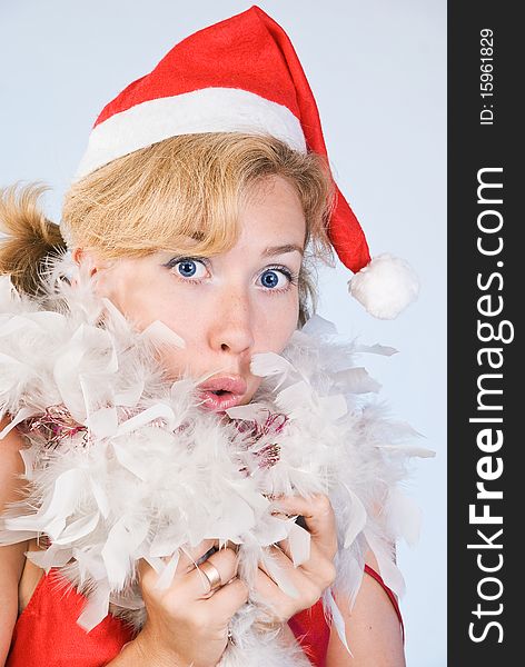 Portrait of surprised woman wearing santa claus clothes on white background. Portrait of surprised woman wearing santa claus clothes on white background