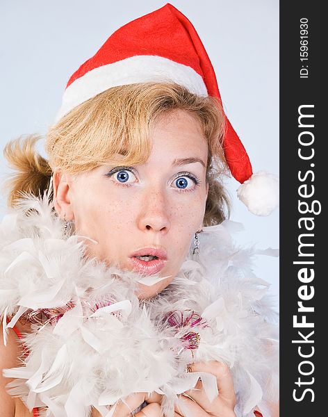 Portrait of surprised woman wearing santa claus clothes on white background. Portrait of surprised woman wearing santa claus clothes on white background