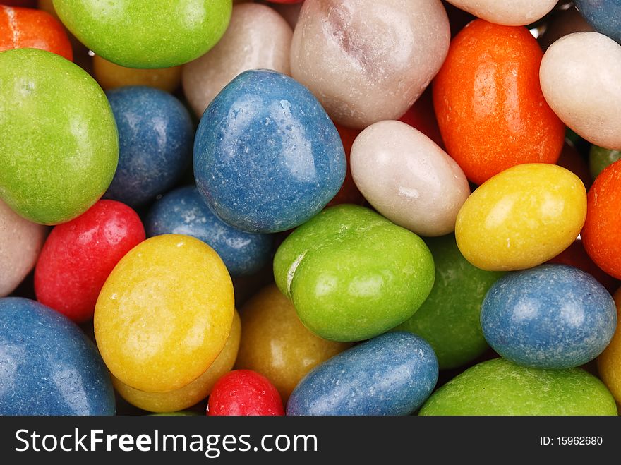 Background from multicolored sweets covered with glaze