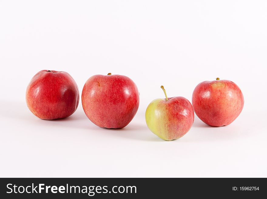 Four fresh ripe red apples