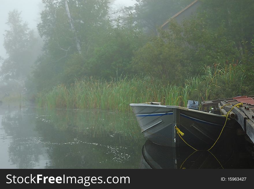 Boat On Misty Lake