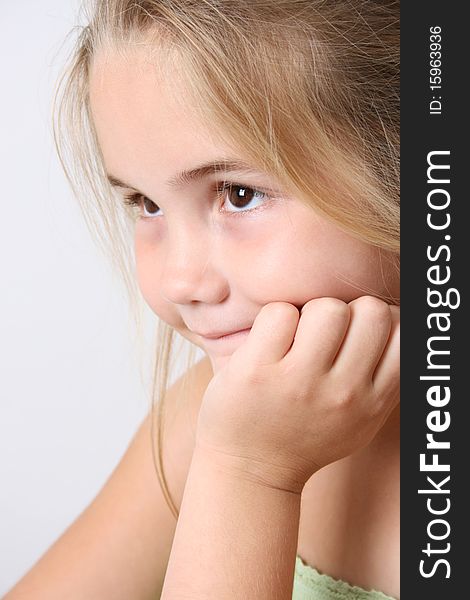 Beautiful young girl against a light background. Beautiful young girl against a light background