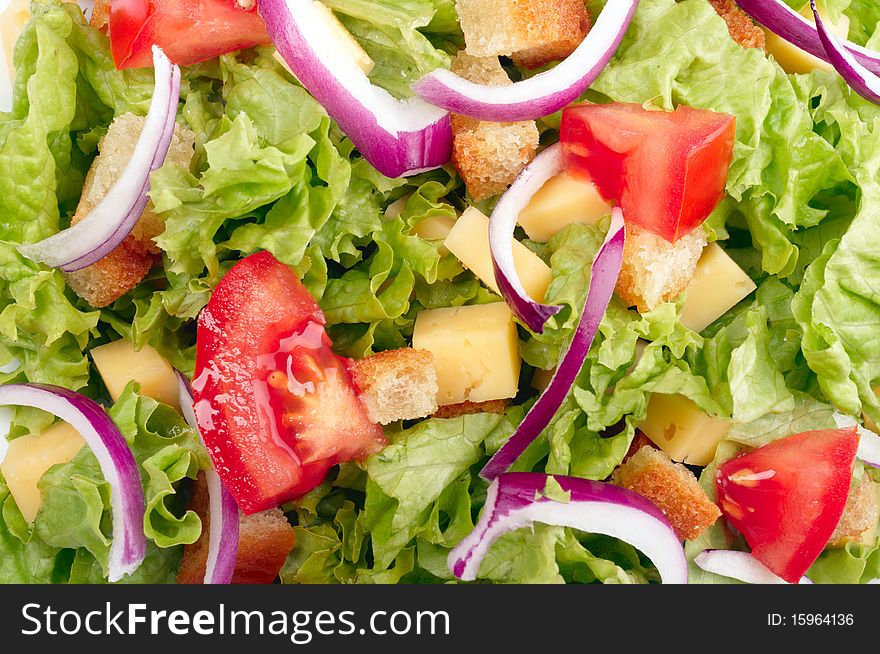 Salad with tomato, cheese and croutons background. Salad with tomato, cheese and croutons background