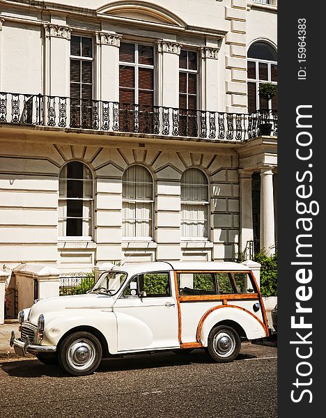 Elegant apartment building and an old car at  Notting Hill, London. Elegant apartment building and an old car at  Notting Hill, London.