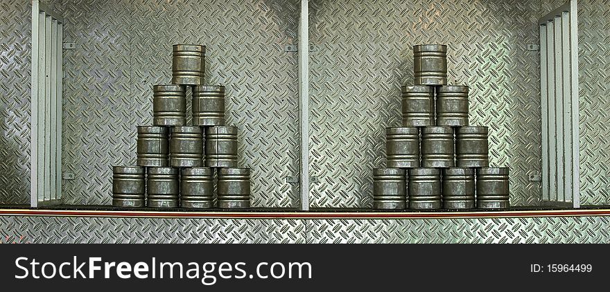 A pyramid out of stacked cans. A pyramid out of stacked cans