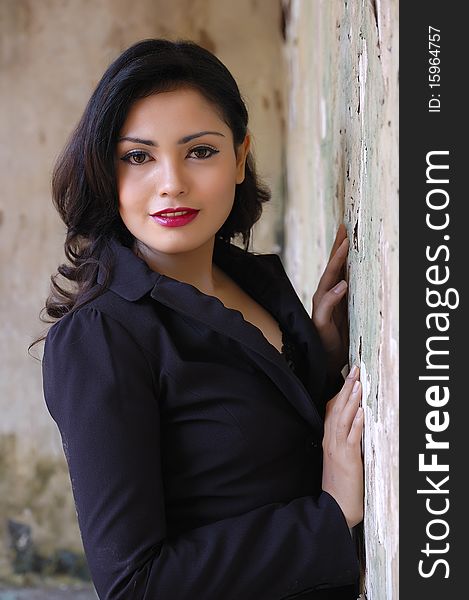 Pretty business woman wearing black suit, posing at outdoor. Pretty business woman wearing black suit, posing at outdoor