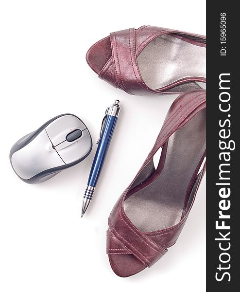 Woman's fashionable shoes with computer mouse and pen. Woman's fashionable shoes with computer mouse and pen