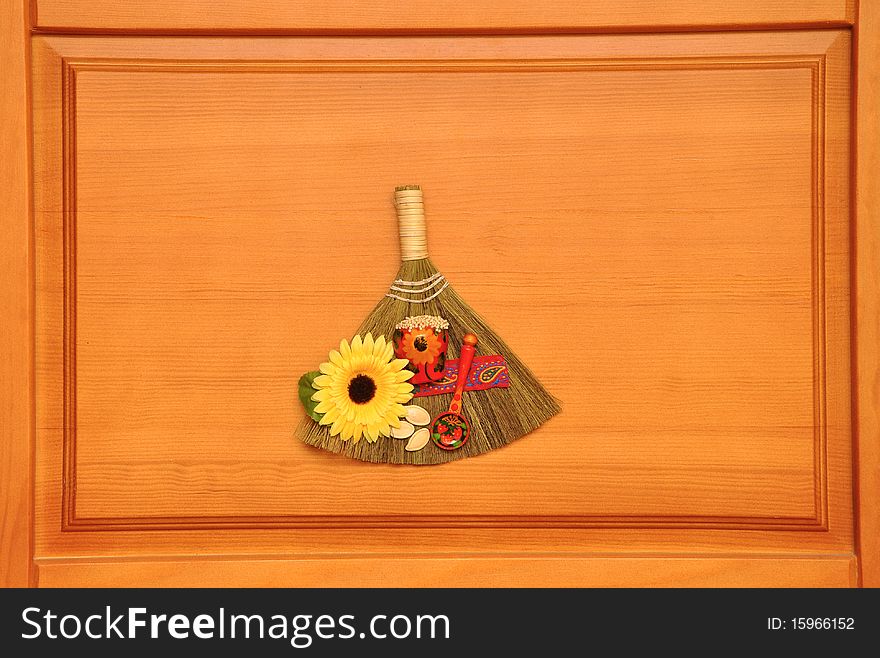 Amulet broom success on wooden background