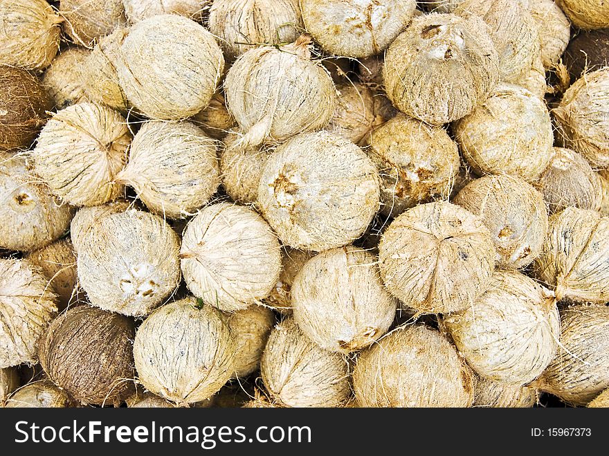 Stack of whole coconuts; full frame food background