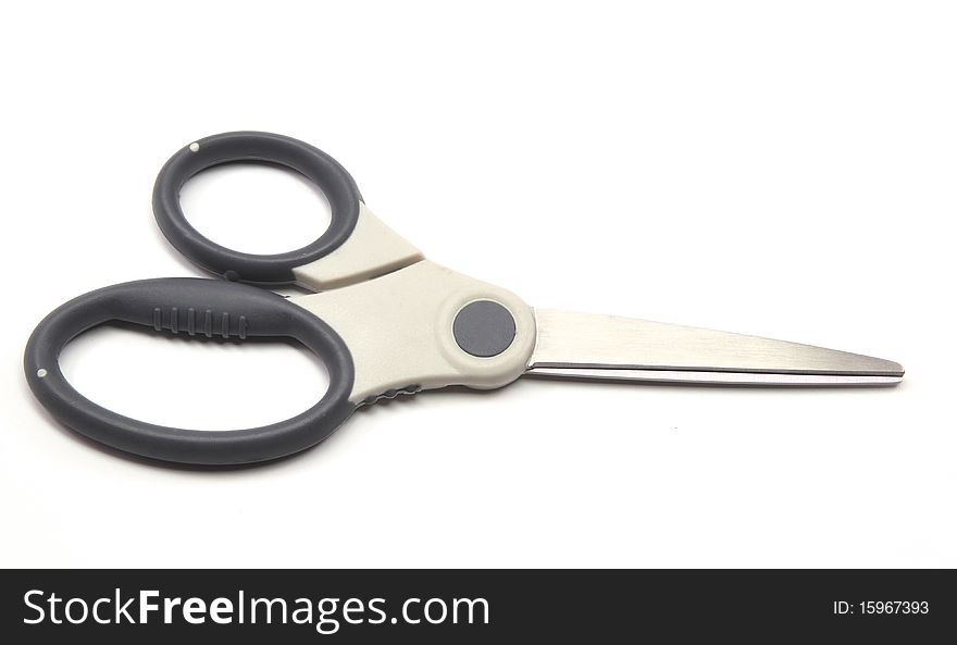 A black and silver scissors in the closed position.