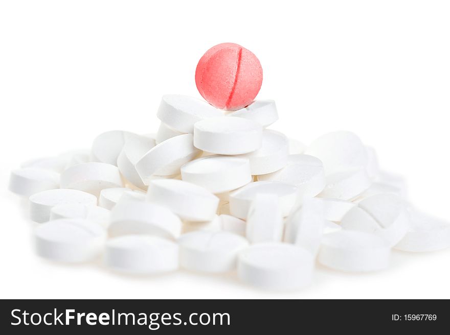 White tablets scattered on table