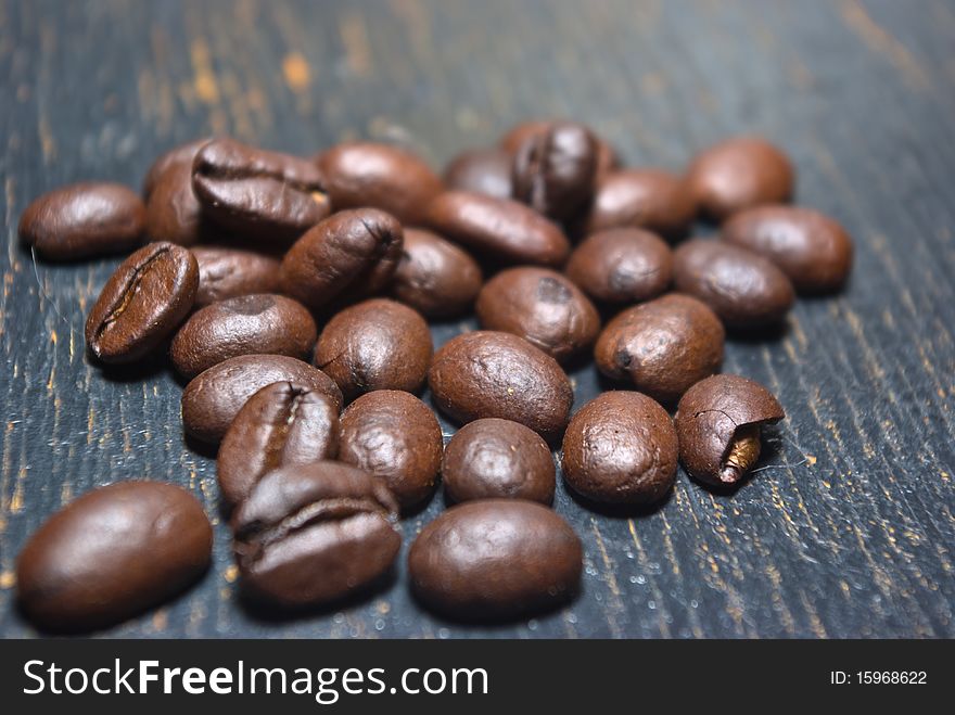 The fragrant fried coffee beans grunge background. The fragrant fried coffee beans grunge background