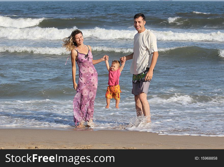 Happy family playing in the sea