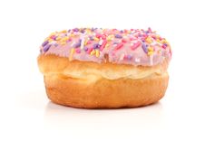 Pink Iced Donut Covered In Sprinkles Royalty Free Stock Image