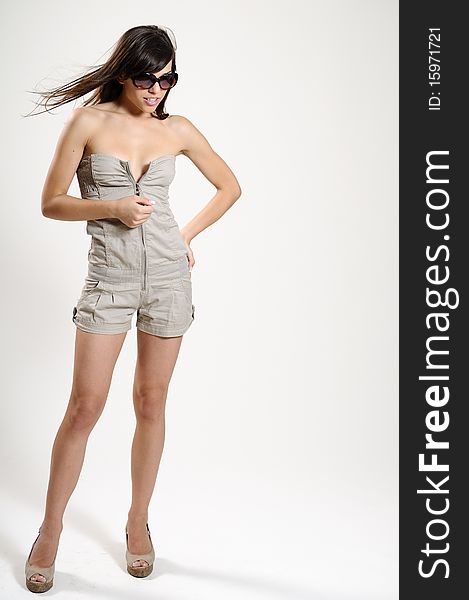 Attractive young woman showing summer collection. Attractive young woman showing summer collection