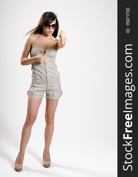 Attractive young woman showing summer collection. Attractive young woman showing summer collection