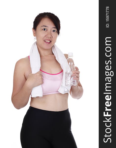 An Asian woman in fitness attire holding a bottle of water. An Asian woman in fitness attire holding a bottle of water