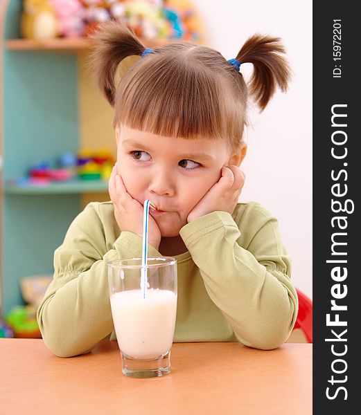 Gloomy Little Girl Drinks Milk
