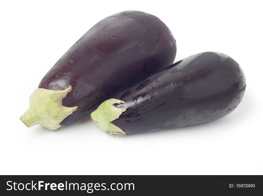 Two fresh zucchini on a white background. Two fresh zucchini on a white background.