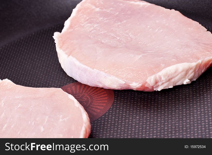 Fresh tasty meat fried in a pan without fat. Fresh tasty meat fried in a pan without fat.