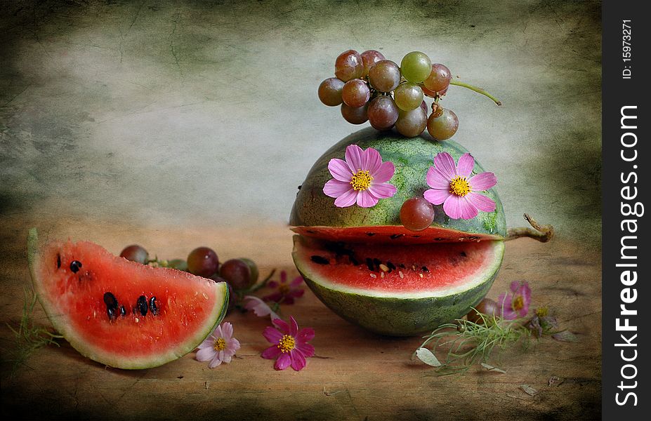 The cut water-melon is an ugly face, instead of eyes flowers. The cut water-melon is an ugly face, instead of eyes flowers