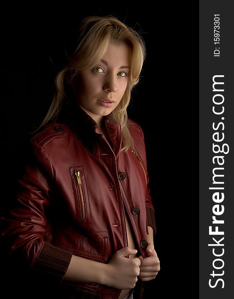 Young beautiful girl in red leather jacket