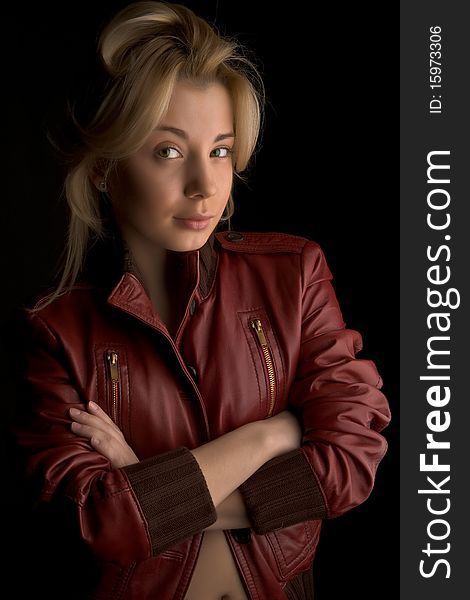 Young beautiful girl in red leather jacket