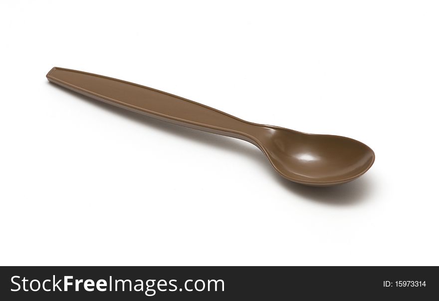 Plastic spoon on a white background
