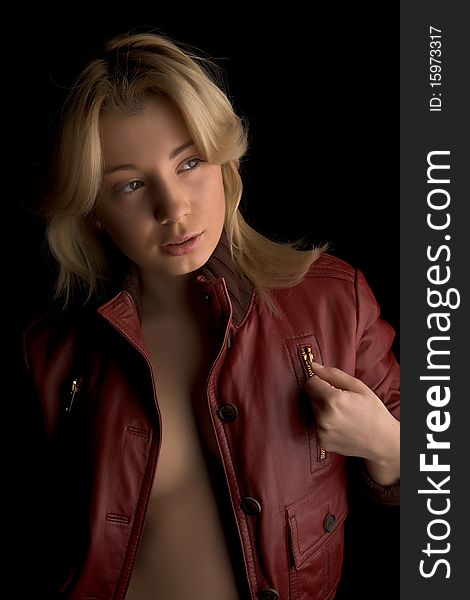 Young beautiful girl in red leather jacket