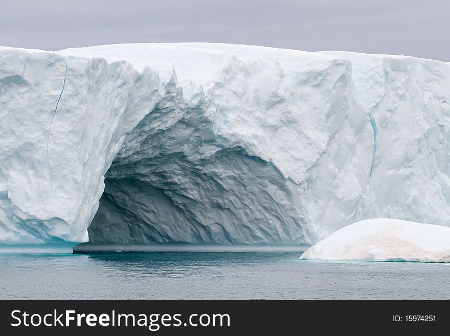 Iceberg in the famous icefjord beside the city of Ilulissat in Greenland. The icefjord is on UNESCO's World Heritage List. Iceberg in the famous icefjord beside the city of Ilulissat in Greenland. The icefjord is on UNESCO's World Heritage List.