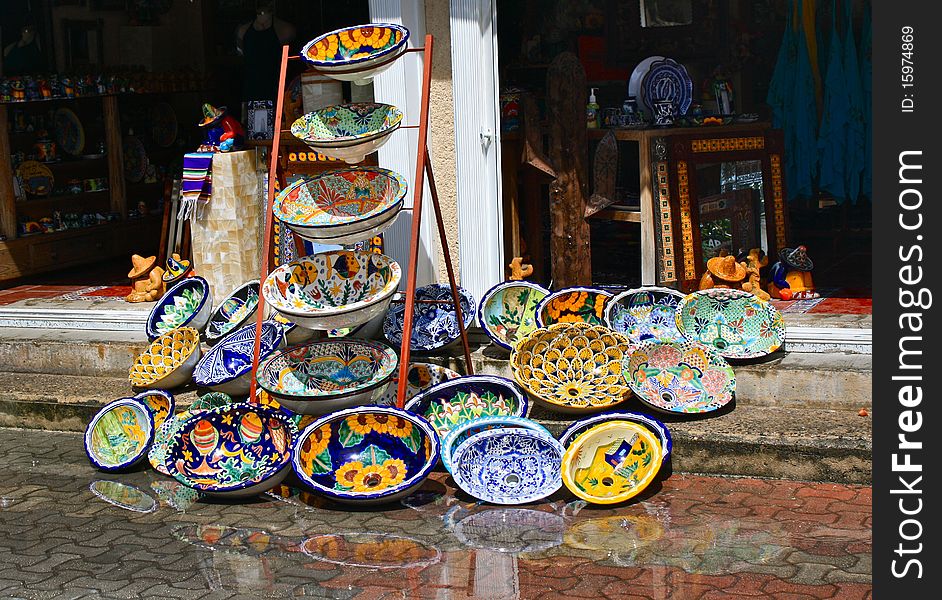 Colorful handicrafted mexican washbasins with reflection