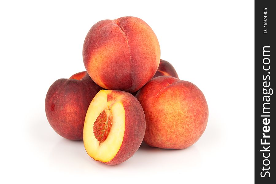Fresh juicy peaches isolated on white