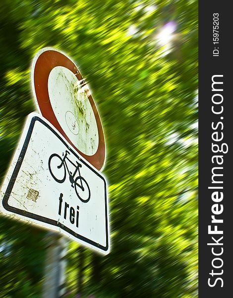 A Traffic Sign in a park for Bikers. A Traffic Sign in a park for Bikers