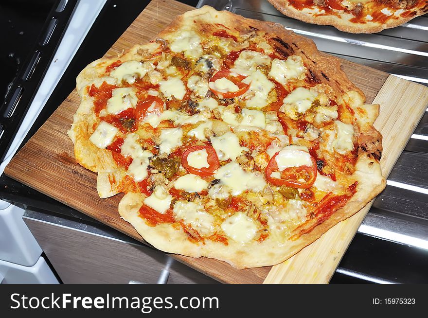 Home made hot pizza with chicken on the table. Home made hot pizza with chicken on the table