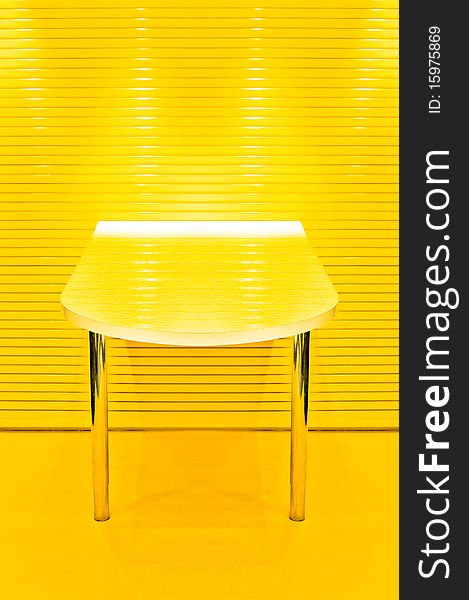 Abstract two legged table in lemon yellow. Abstract two legged table in lemon yellow