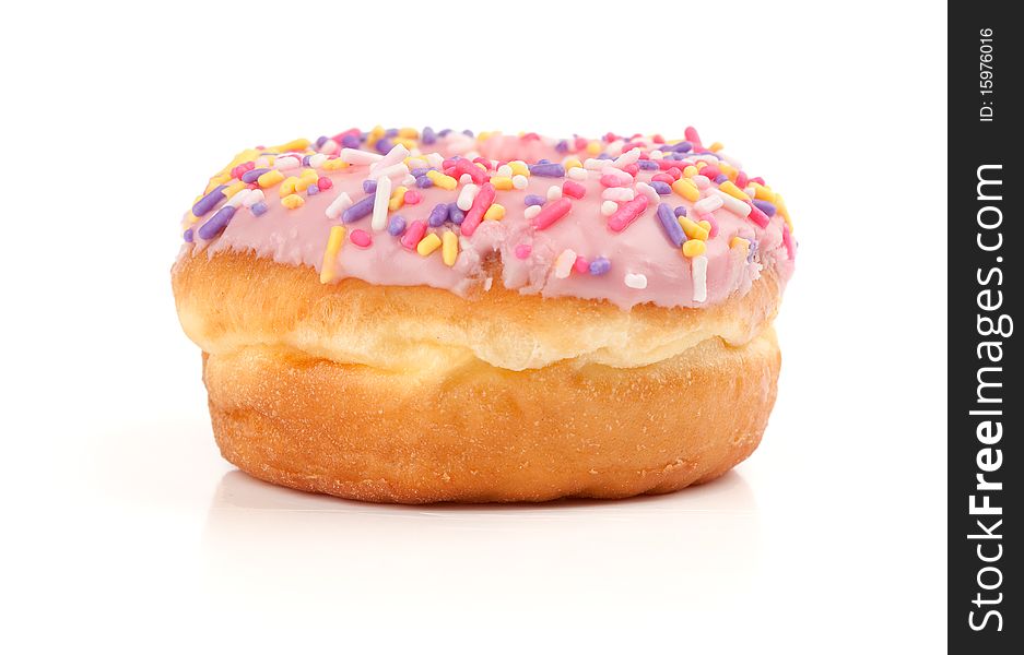 Pink Iced Donut covered in sprinkles isolated against white background