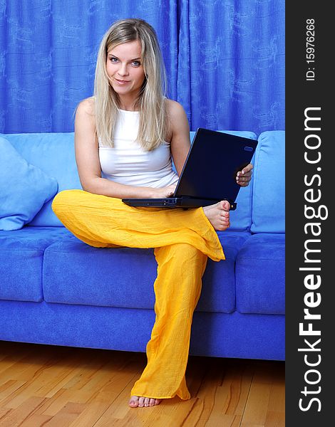 Woman working with PC at home in sofa