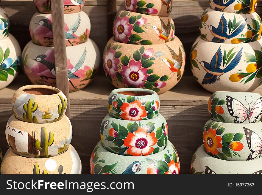 Variety of Colorfully Painted Ceramic Pots in an Outdoor Shopping Market. Variety of Colorfully Painted Ceramic Pots in an Outdoor Shopping Market.