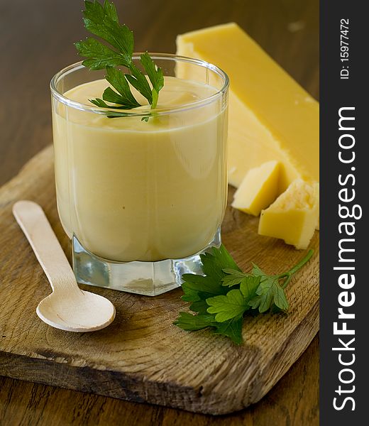 Cheese soup with roasted garlic and cheese chips