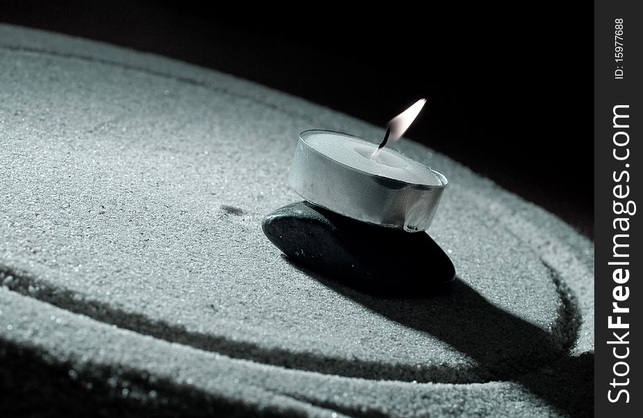 Conceptual Image of Balance With Candle, Stone And Sand